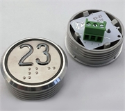 Кнопка приказа. Cимвол: 23-й этаж; код Брайля: имеется; материалы: нержавеющая сталь, алюминий, пластик; подсветка: красная; установочное место: 32 мм.